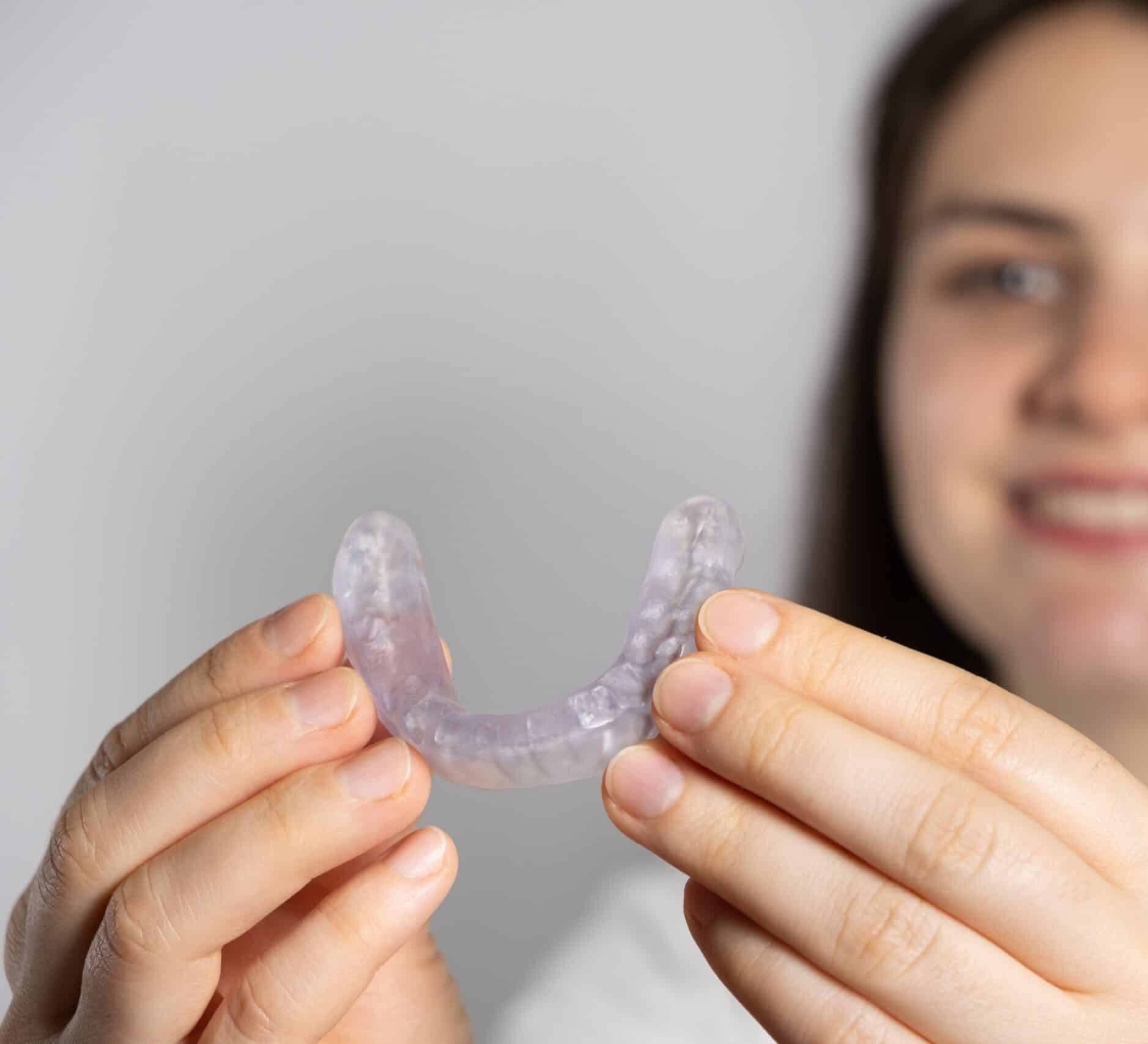 A,Woman,Holds,Dental,Mouthguard,,Splint,For,The,Treatment,Of