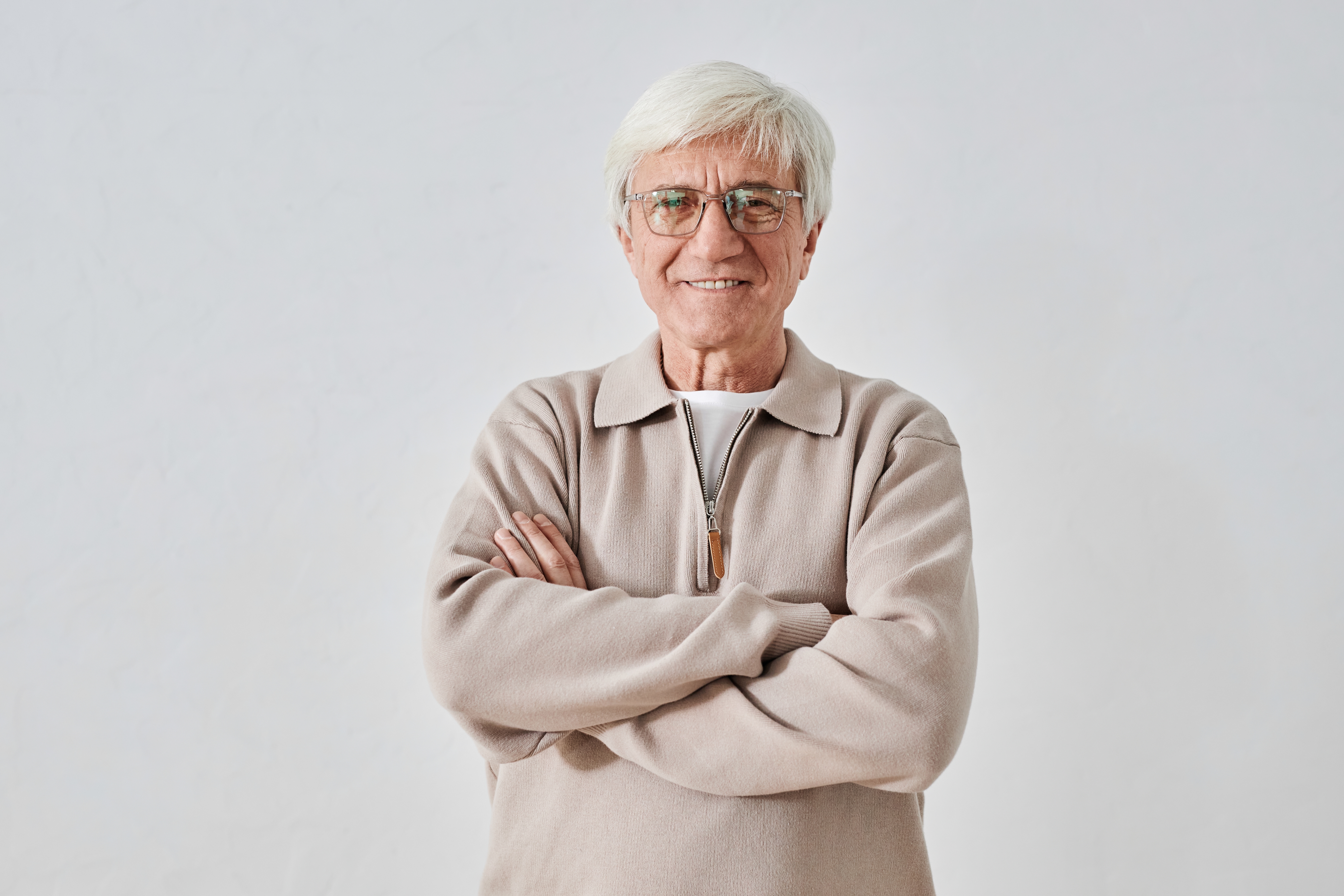 Waist,Up,Portrait,Of,Smiling,White-haired,Senior,Man,Wearing,Beige