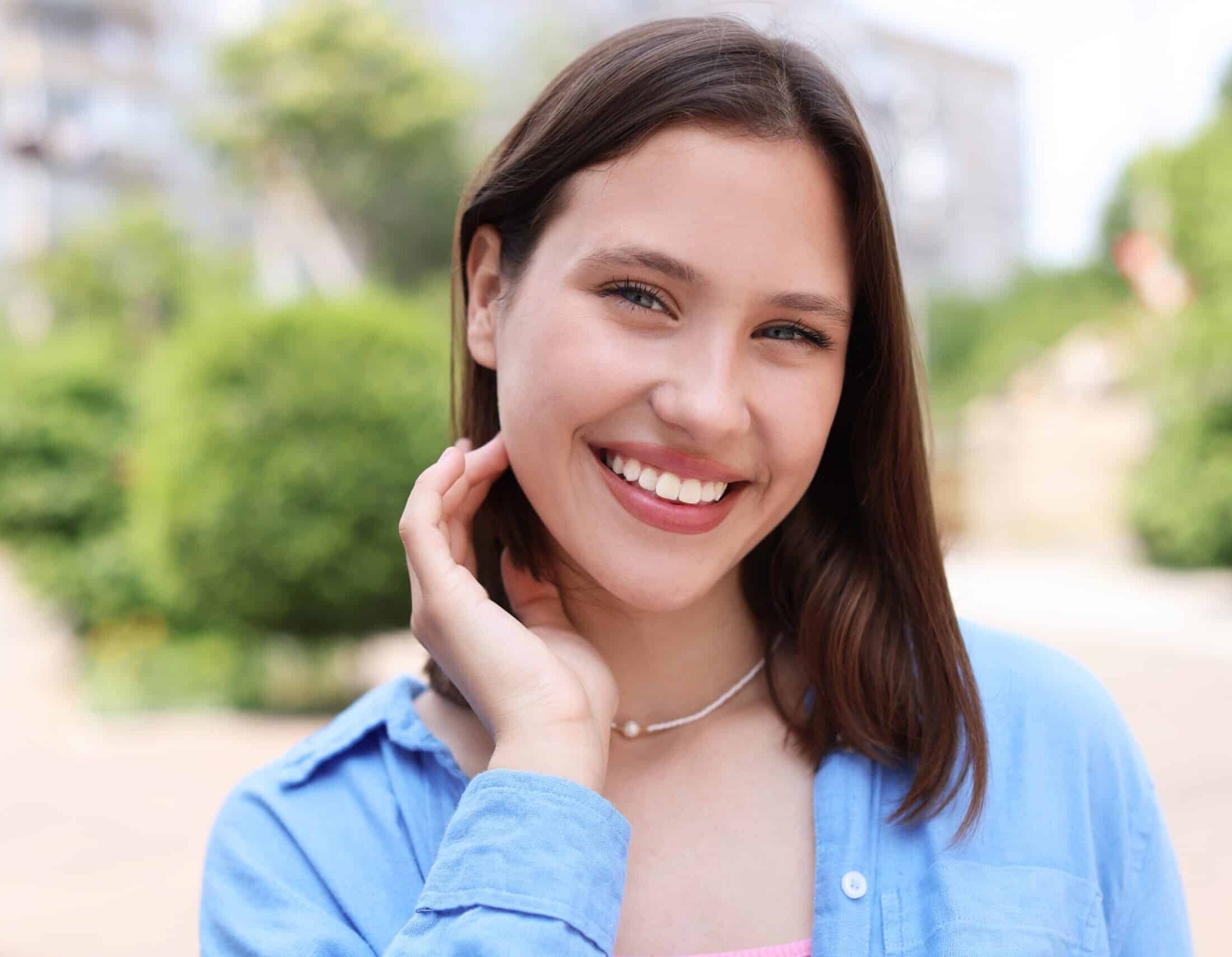 Portrait,Of,Smiling,Teenage,Girl,On,City,Street