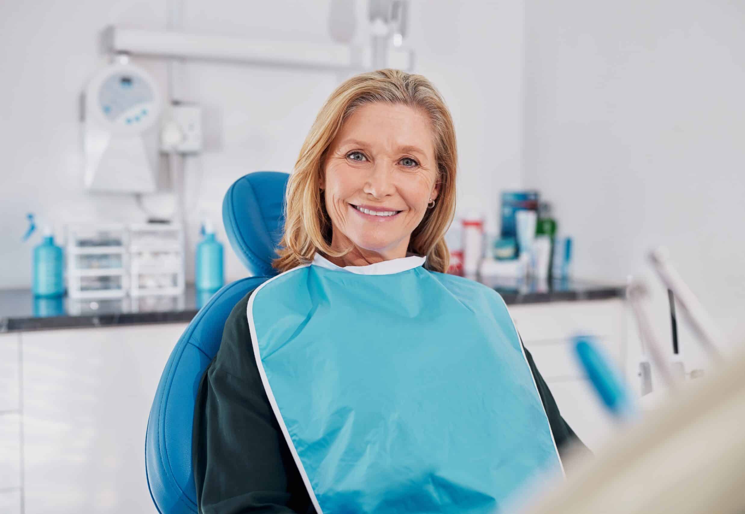 Old,Beautiful,Lady,Smiling,While,Seated,On,Dental,Chair,Wearing