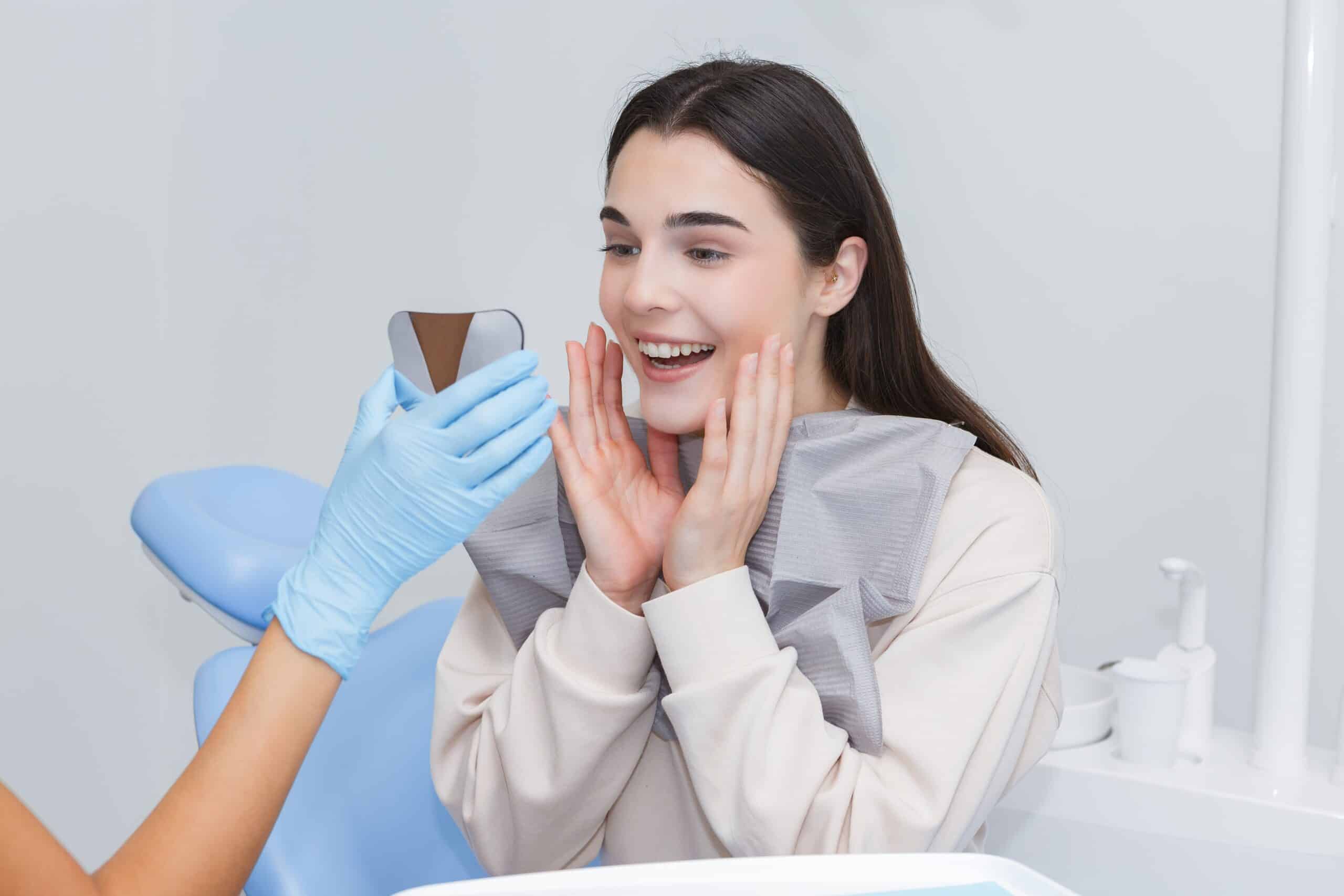 A,Dentist,Shows,A,Mirror,To,A,Young,Female,Patient